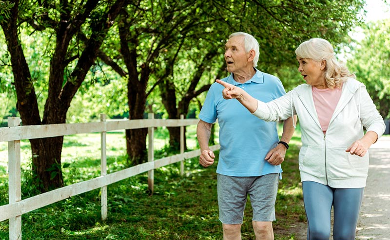 elderly couple walking