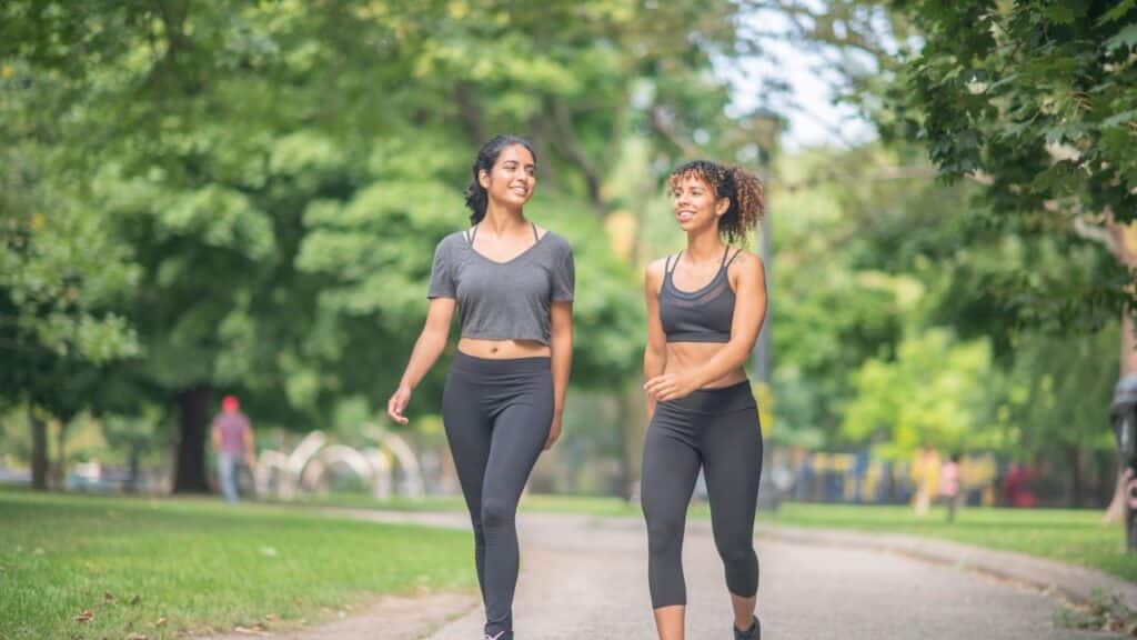 women walking in park