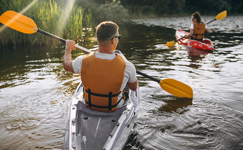 couple kayaking in lake