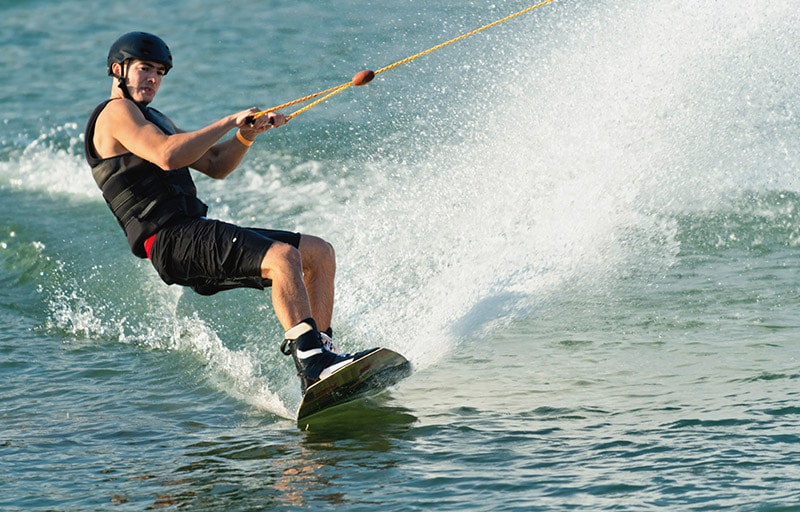 man riding wakeboard