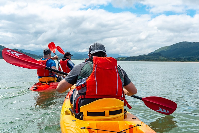 men in kayaks