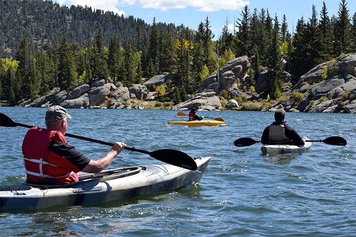 men in kayaks