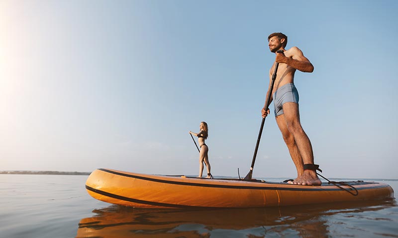 couple on paddle boards