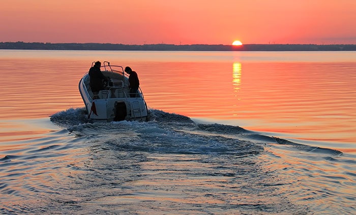 speedboat at sunset