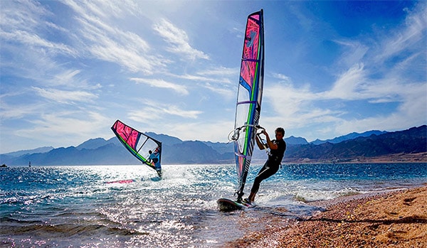 two guys windsurfing