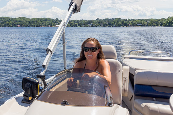 woman driving pontoon