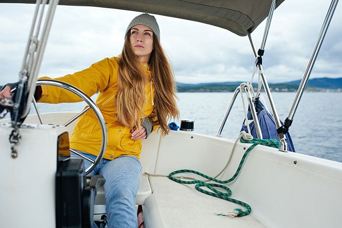 woman driving yacht