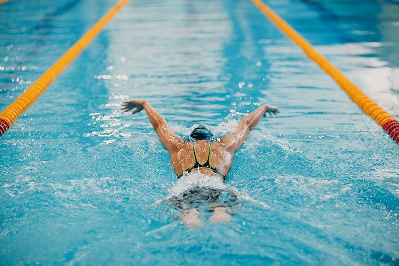 woman doing swim strokes