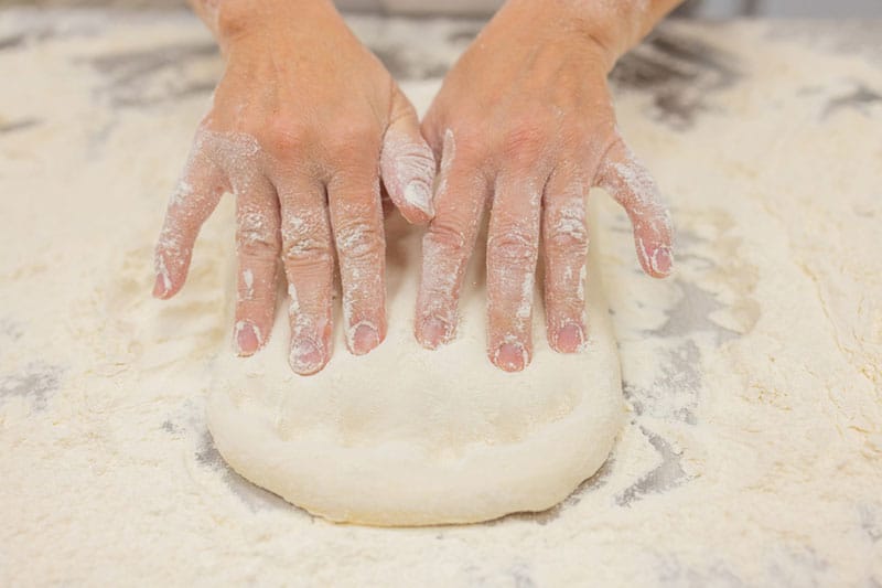 kneading pizza dough