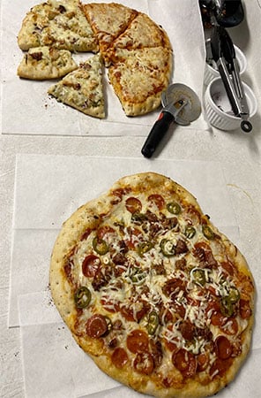 cut pizza on counter