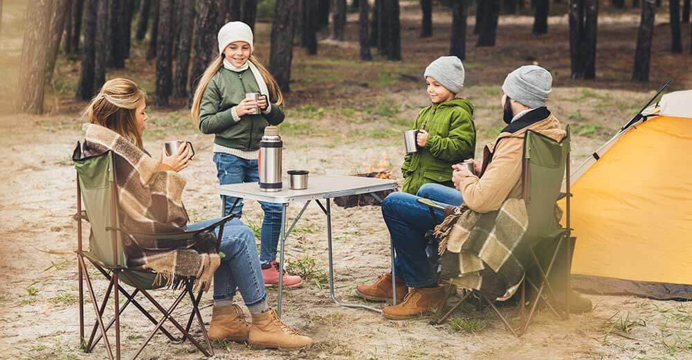 family at camping table