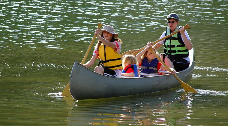 family on canoe