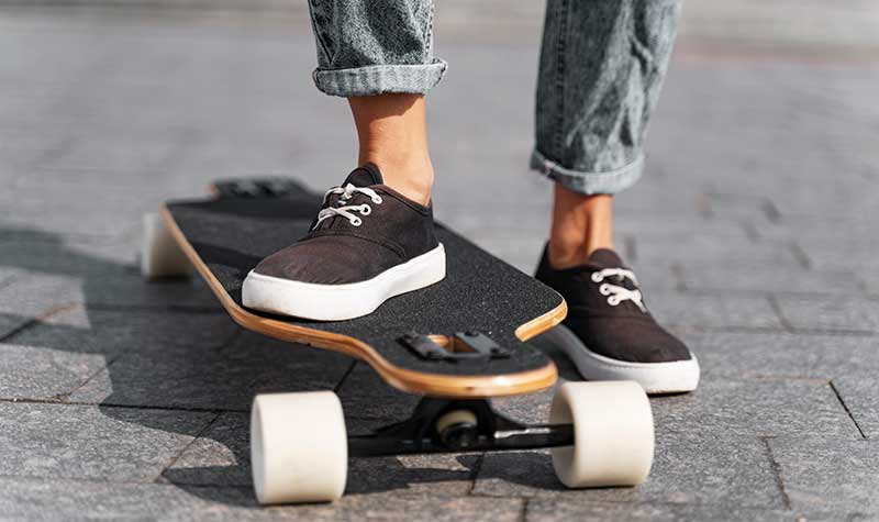 foot on longboard