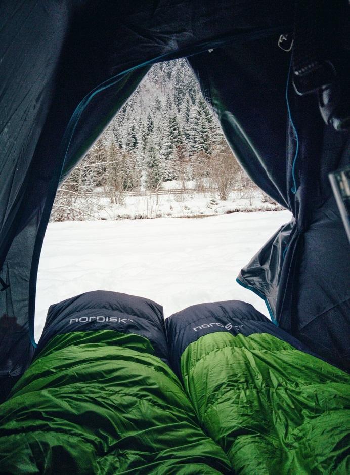 sleeping bags in snowy tent