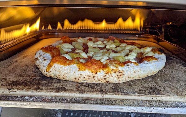 pizza on stone in oven