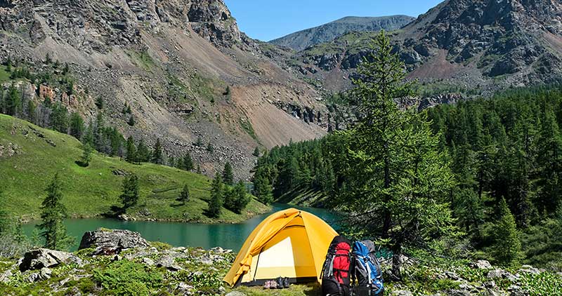 camping by water in mountains