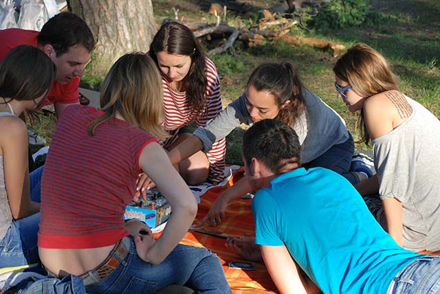 teens playing games at camp