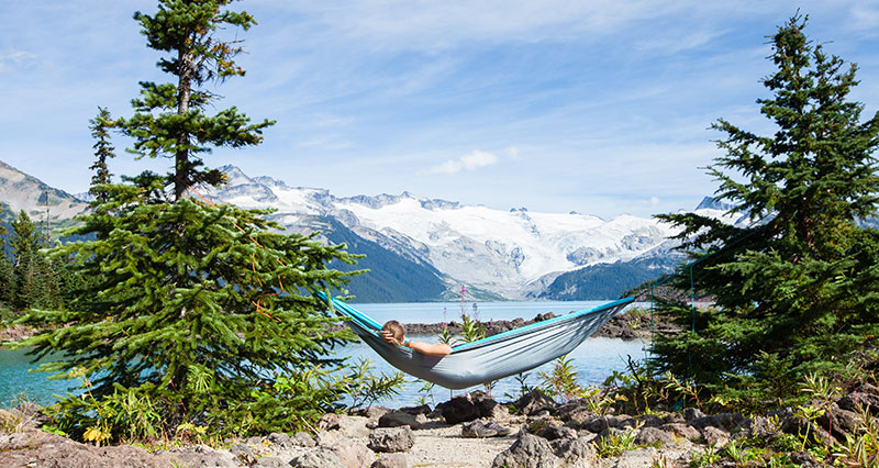 woman in camping hammock in Garibaldi Lakes, BC