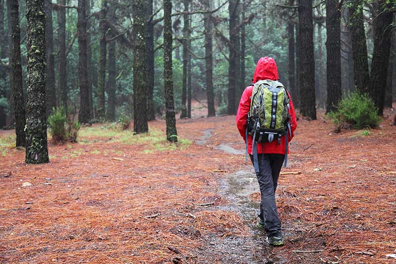 woman hiking in rain