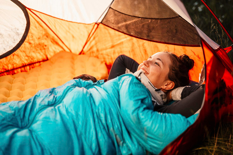 woman relaxing and lie in a sleeping bag